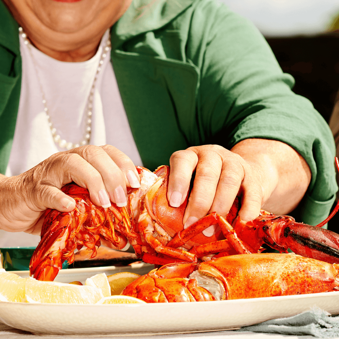 Person handling a lobster