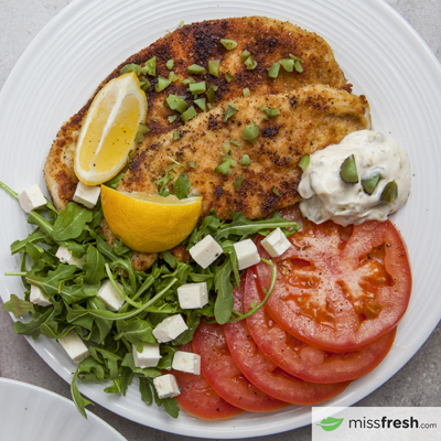 Turkey schnitzel with Caper Mayo capers, Lemon and Tomatoes with Feta Cheese